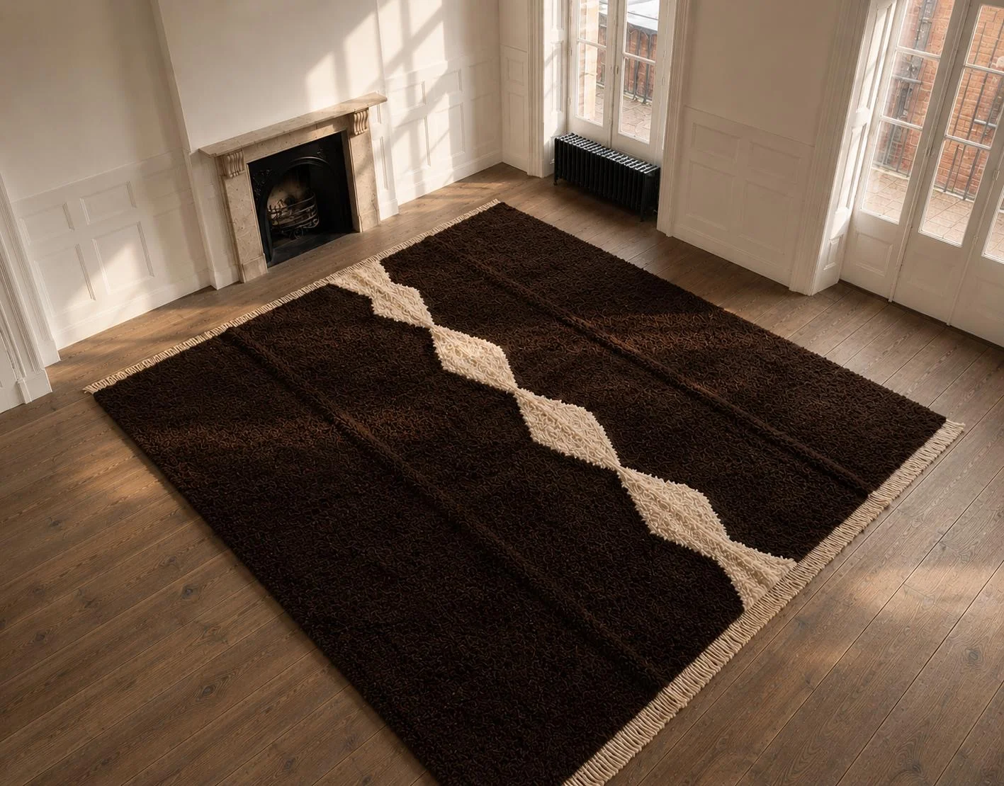 Brown rug with an undulating ivory line in a sunlit room with a wooden floor.
